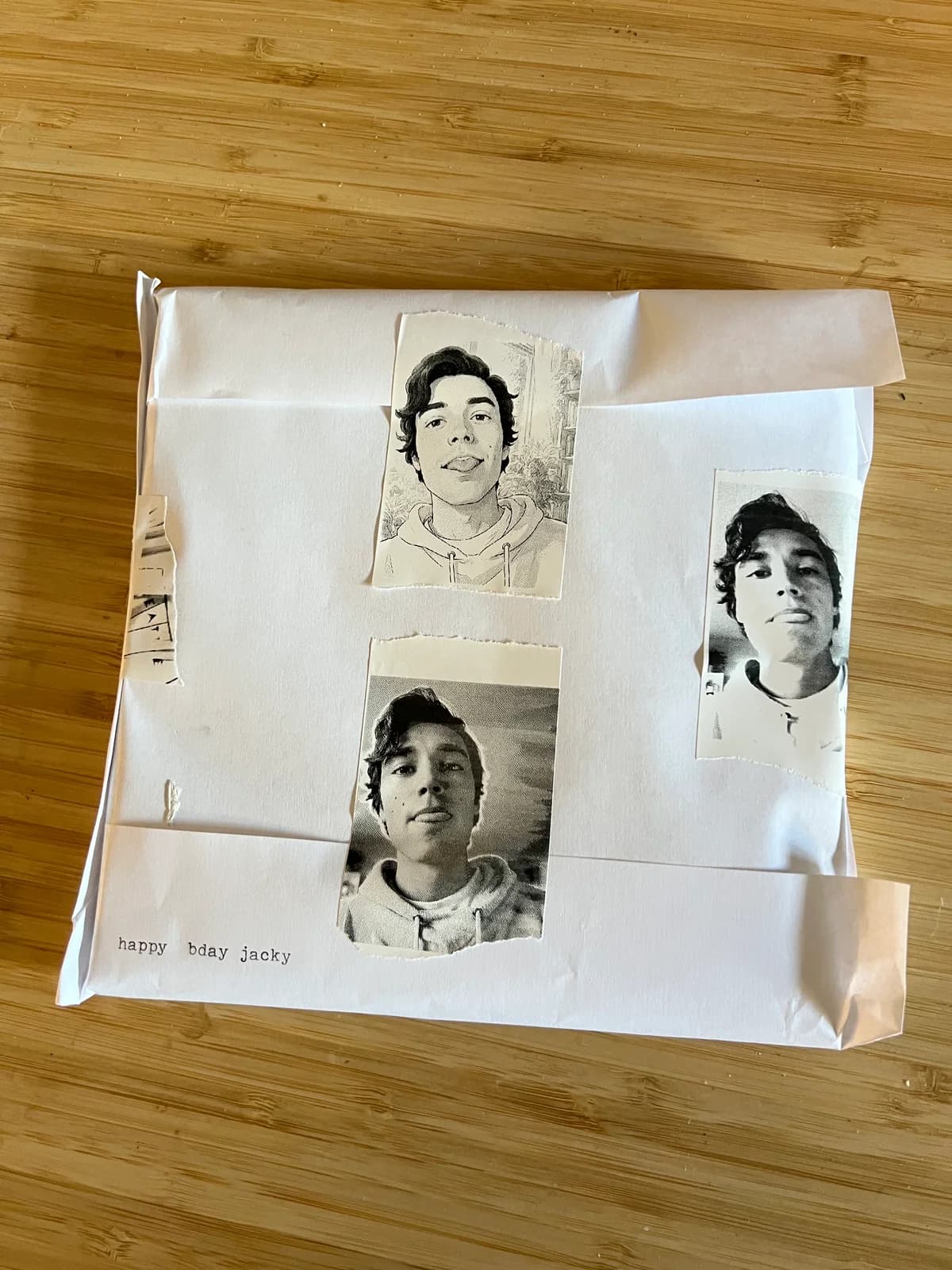 Gift wrapped in white paper decorated with custom black-and-white portrait stickers